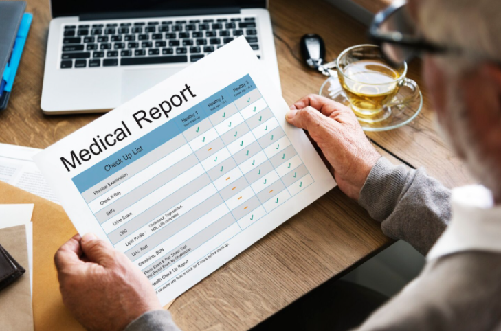 man looking at health records