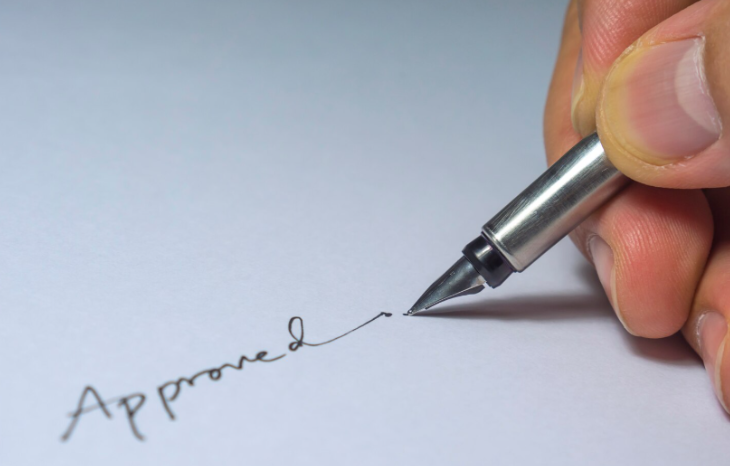 Person writing shorthand notes by hand