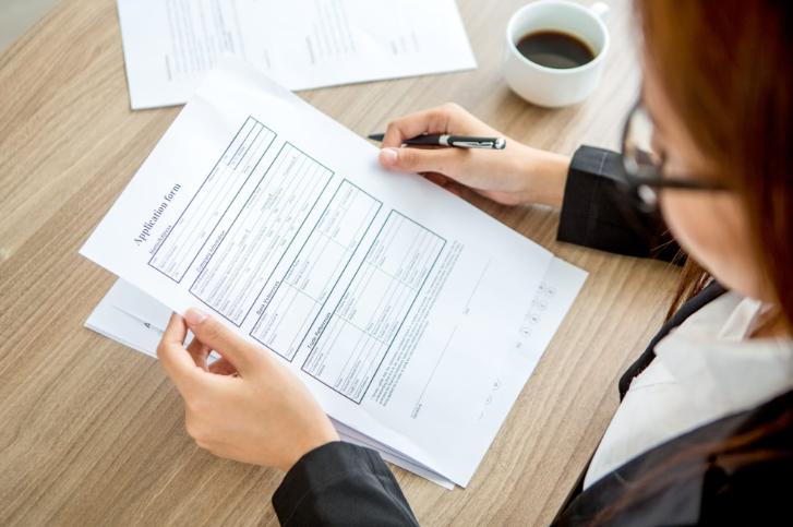 woman reading medical form information